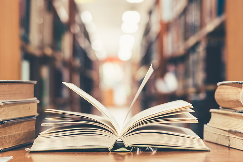 a book flipping through pages in a library